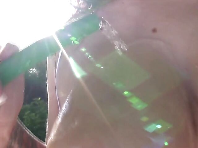 Busty model with big natural tits Satinee Capona gets wet under the palm tree