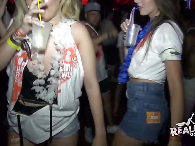 Wild party girls get naked in the crowd