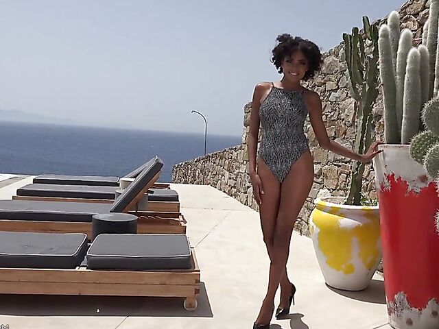 Perfect ebony babe Luna Corazon posing nude by the pool in Greece