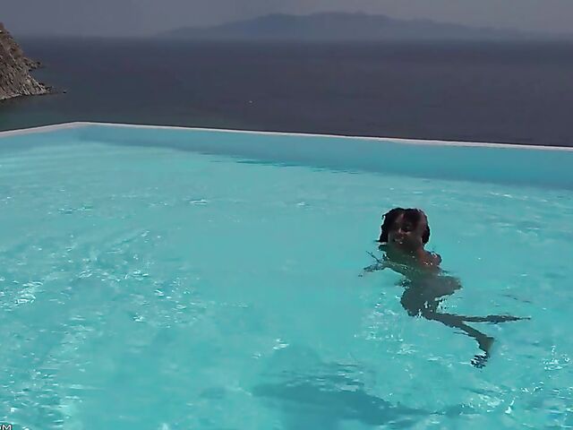 Perfect ebony babe Luna Corazon posing nude by the pool in Greece