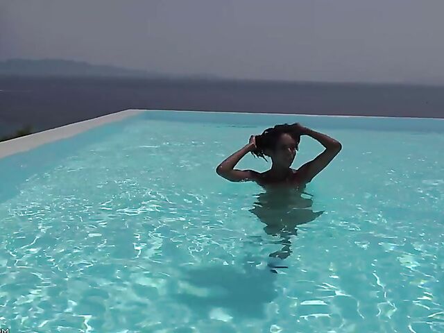 Perfect ebony babe Luna Corazon posing nude by the pool in Greece