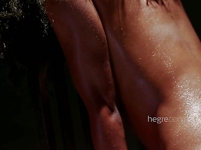 Sweaty ebony Katherina riding a chair with a magic wand in it