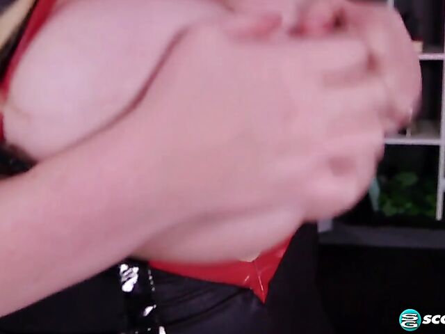 Pink hair blonde Suzumi Wilder is a chubby big tits woman who loves wearing fetish outfits and playing with herself