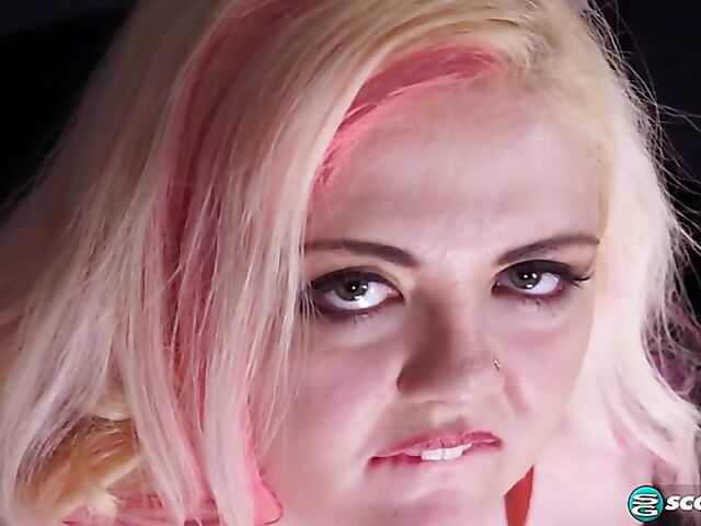 Pink hair blonde Suzumi Wilder is a chubby big tits woman who loves wearing fetish outfits and playing with herself