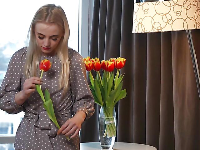 Lonely Lottie enjoying the scent of flowers and rubbing pussy