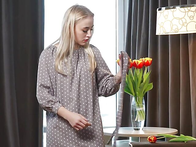 Lonely Lottie enjoying the scent of flowers and rubbing pussy