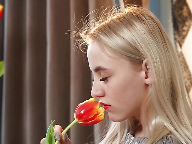 Lonely Lottie enjoying the scent of flowers and rubbing pussy