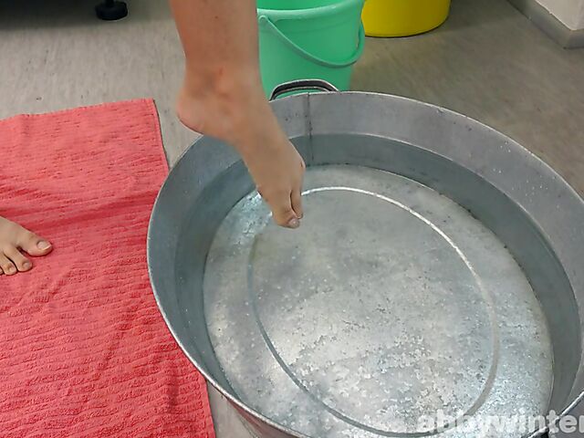 Hairy brunette Ayesha washing in the middle of the kitchen