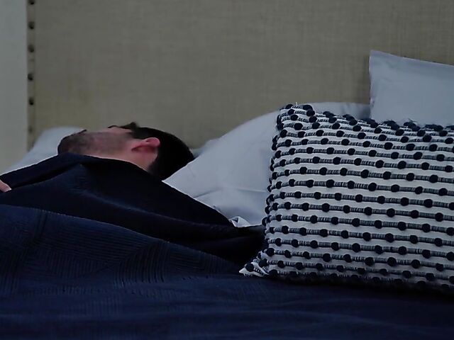 Brunette nurse Luz masturbating next to a sleeping guy in his bed