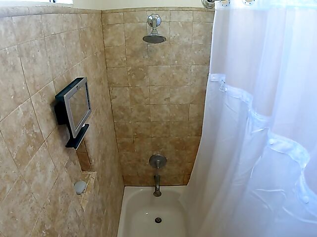 Brunette nurse Luz masturbating next to a sleeping guy in his bed