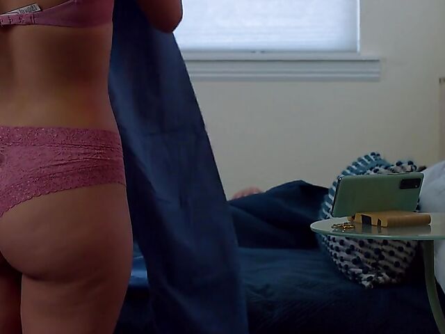 Brunette nurse Luz masturbating next to a sleeping guy in his bed