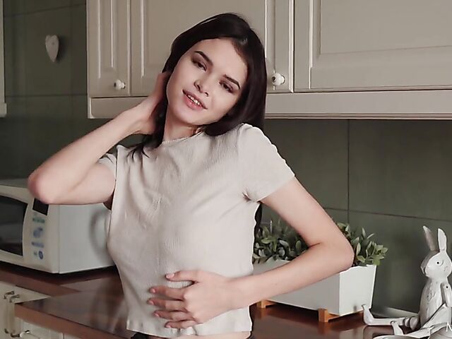 Brunette teen babe Kinsley White masturbates in the kitchen