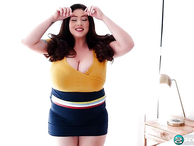 Busty chubby woman Demora Avarice changing clothes and showing off her heavy hangers