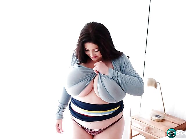 Busty chubby woman Demora Avarice changing clothes and showing off her heavy hangers