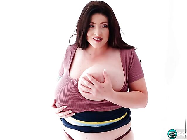 Busty chubby woman Demora Avarice changing clothes and showing off her heavy hangers