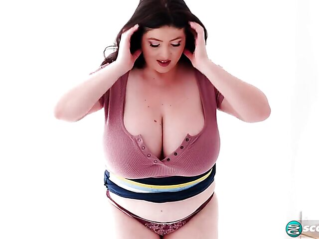 Busty chubby woman Demora Avarice changing clothes and showing off her heavy hangers