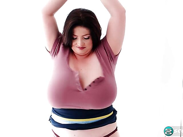 Busty chubby woman Demora Avarice changing clothes and showing off her heavy hangers