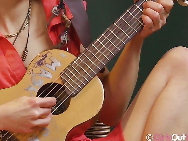 Australian solo artist Ruby Rosette lays aside her guitar to masturbate