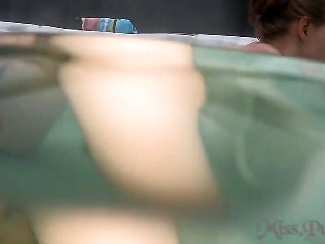 Underwater masturbation with a glass dildo in the hot tub with Miss Pussy Cat