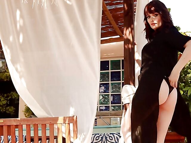 Glamour babe in black Jess Lou stripping outdoors