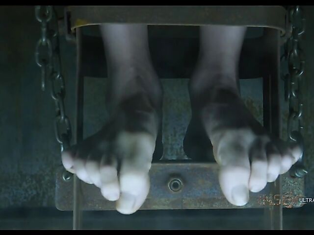 Pale skin girl Brooke Johnson in metal bondage