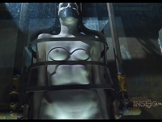 Pale skin girl Brooke Johnson in metal bondage