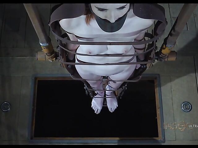 Pale skin girl Brooke Johnson in metal bondage