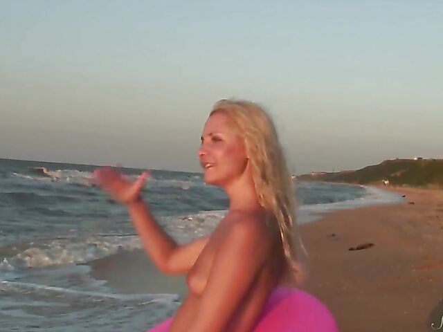 Nudist teen Agnes poses on the beach and takes a dip