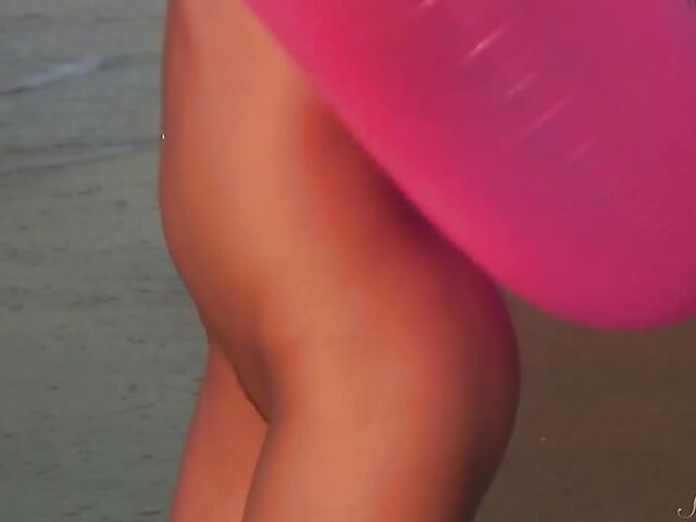 Nudist teen Agnes poses on the beach and takes a dip