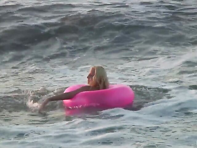 Nudist teen Agnes poses on the beach and takes a dip