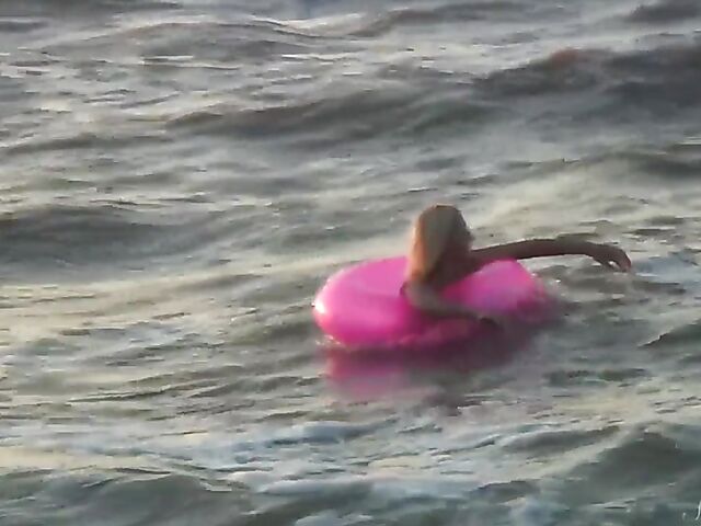 Nudist teen Agnes poses on the beach and takes a dip