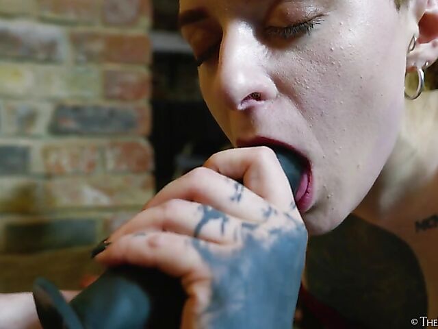 Tattooed redhead Bryla loves her black inflatable dildo