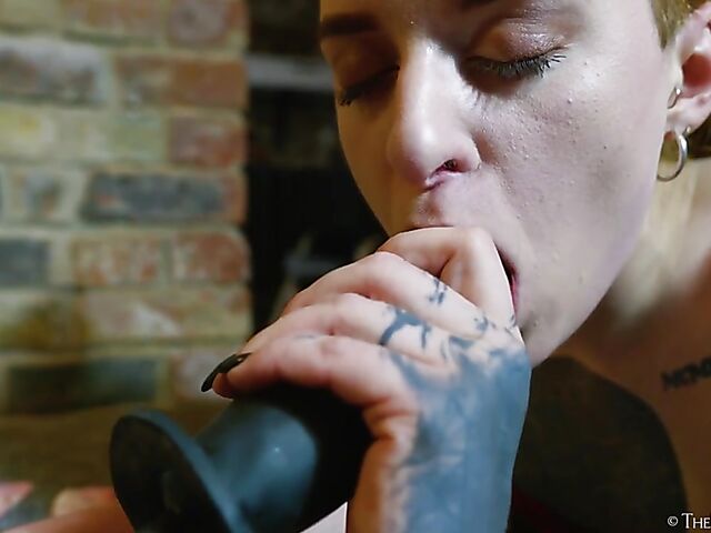 Tattooed redhead Bryla loves her black inflatable dildo