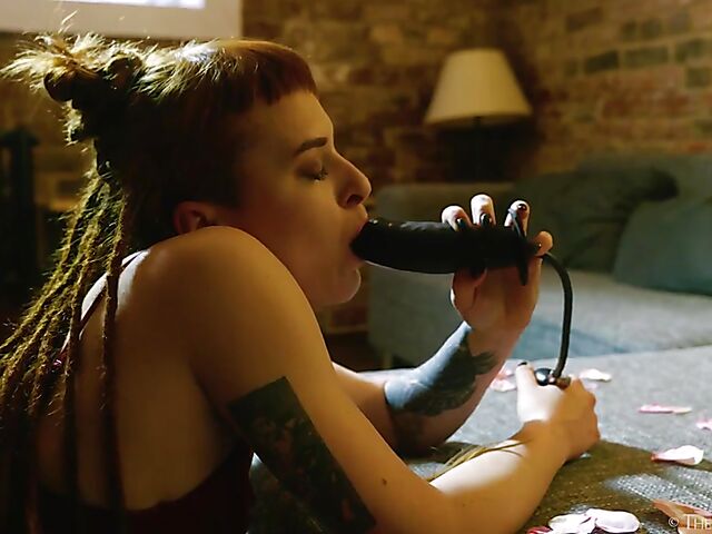 Tattooed redhead Bryla loves her black inflatable dildo