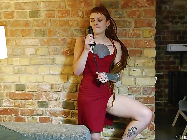 Tattooed redhead Bryla loves her black inflatable dildo