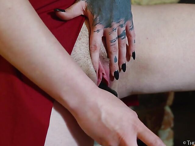 Tattooed redhead Bryla loves her black inflatable dildo