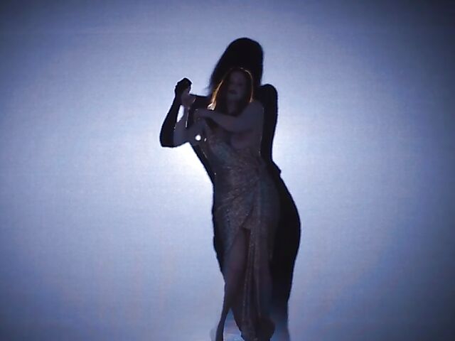 Sexy redhead Maitland Ward does a strip tease on stage