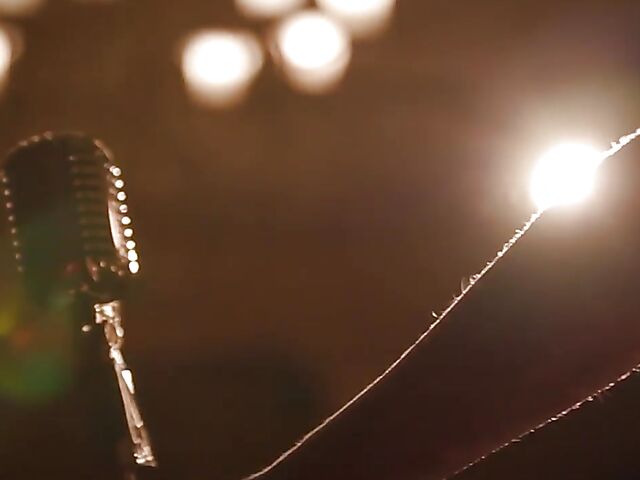 Sexy redhead Maitland Ward does a strip tease on stage