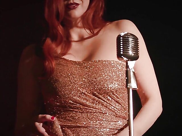 Sexy redhead Maitland Ward does a strip tease on stage