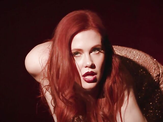 Sexy redhead Maitland Ward does a strip tease on stage