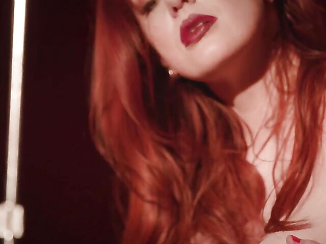 Sexy redhead Maitland Ward does a strip tease on stage