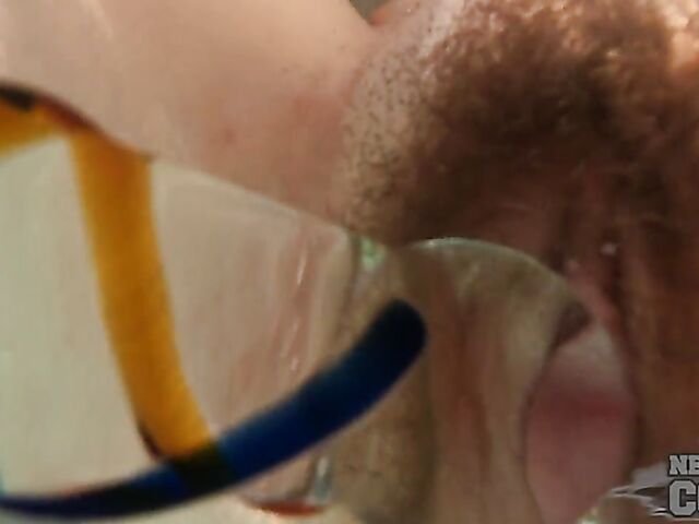 Underwater masturbation with a dildo in the hot tub with inked redhead Brille