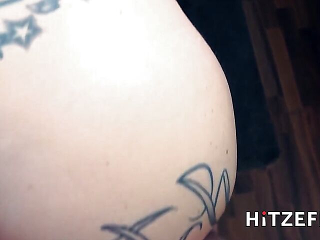 German tattooed MILF Julia Exclusiv gets her fake boobs fucked