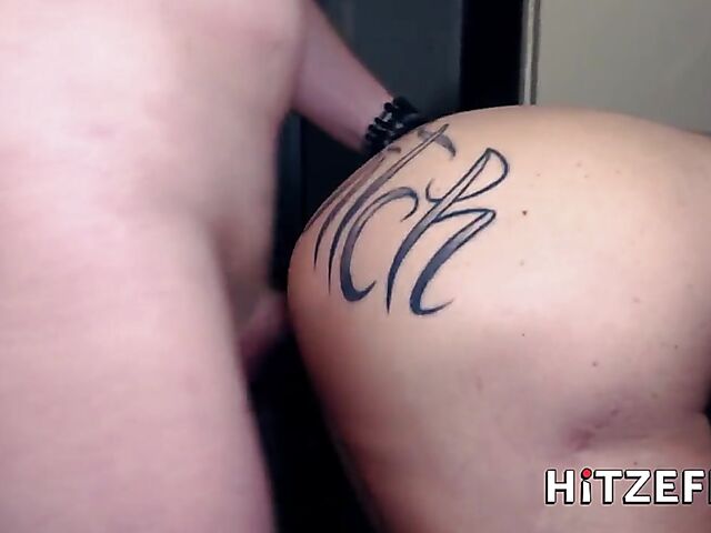 German tattooed MILF Julia Exclusiv gets her fake boobs fucked