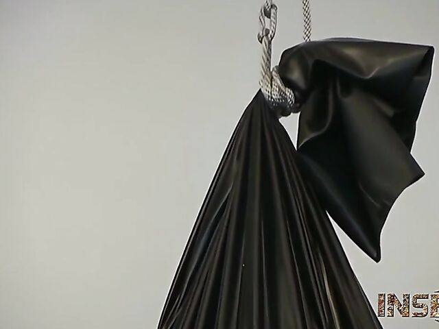 Rubber bondage and more BDSM fun with a busty slave