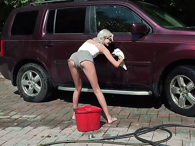 Skinny blonde Tallie Lorain spreading pussy outdoors during the car wash