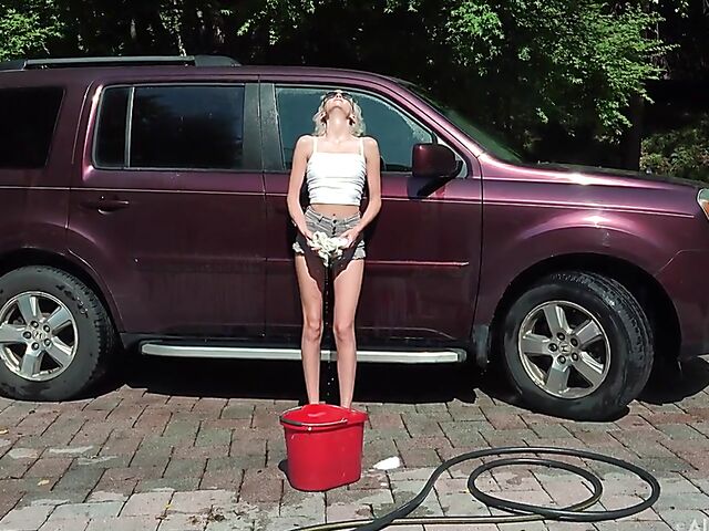 Skinny blonde Tallie Lorain spreading pussy outdoors during the car wash