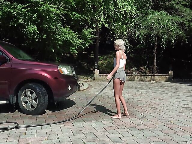 Skinny blonde Tallie Lorain spreading pussy outdoors during the car wash
