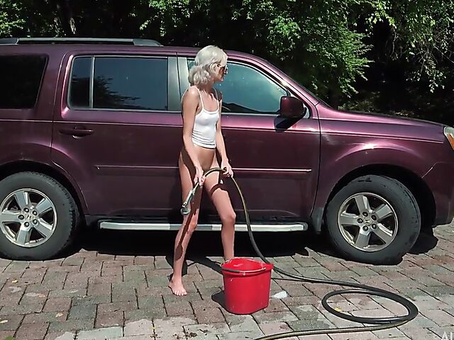 Skinny blonde Tallie Lorain spreading pussy outdoors during the car wash