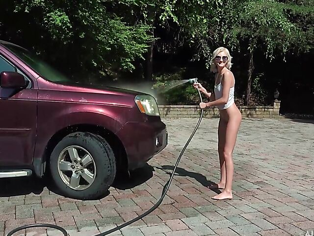 Skinny blonde Tallie Lorain spreading pussy outdoors during the car wash